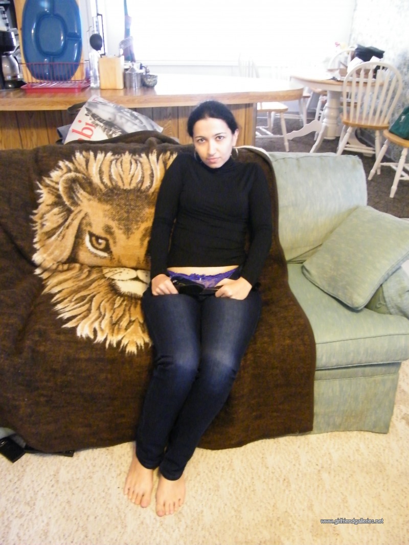 Curvy wife takes her jeans off on the couch 