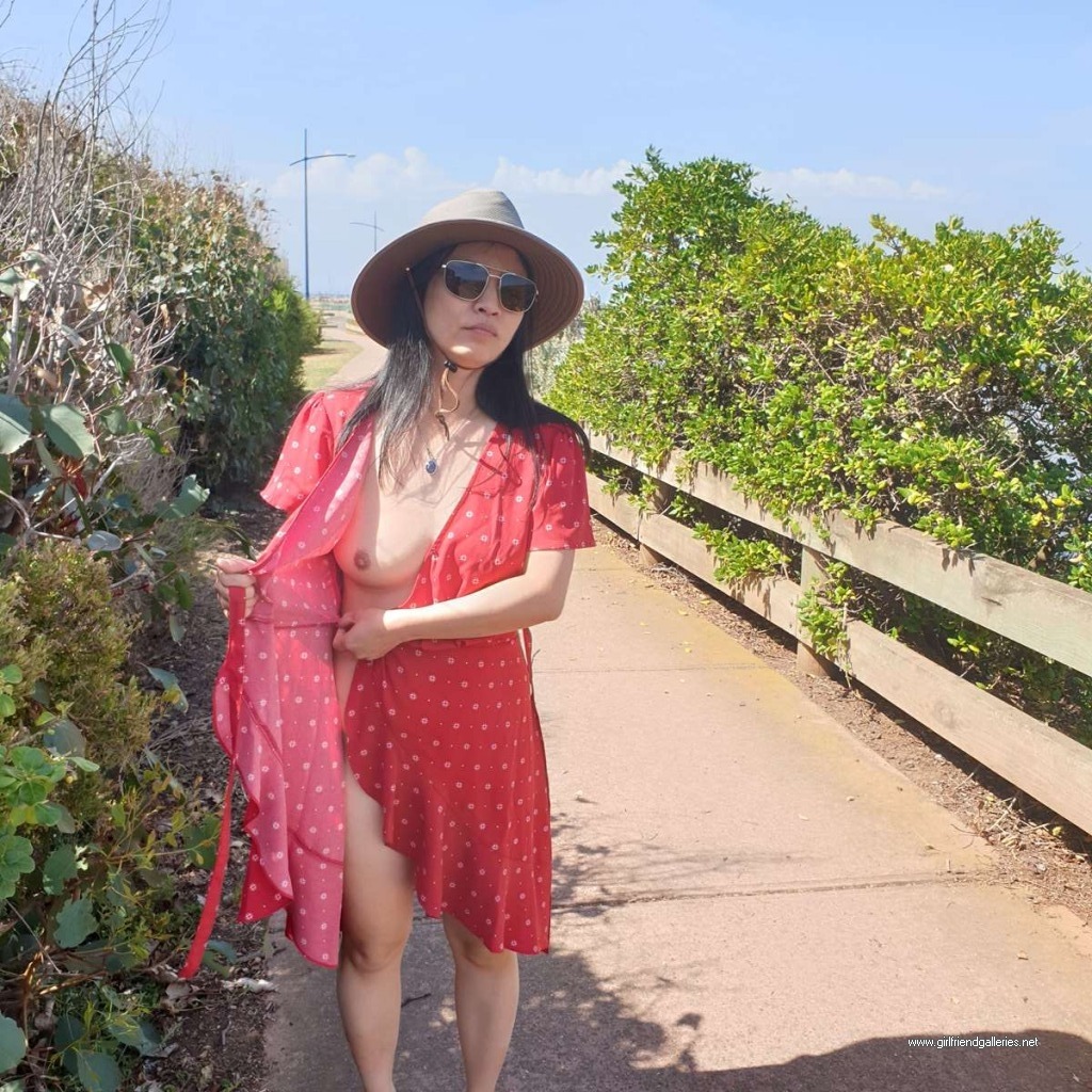 Chinese wife flashing at the beach