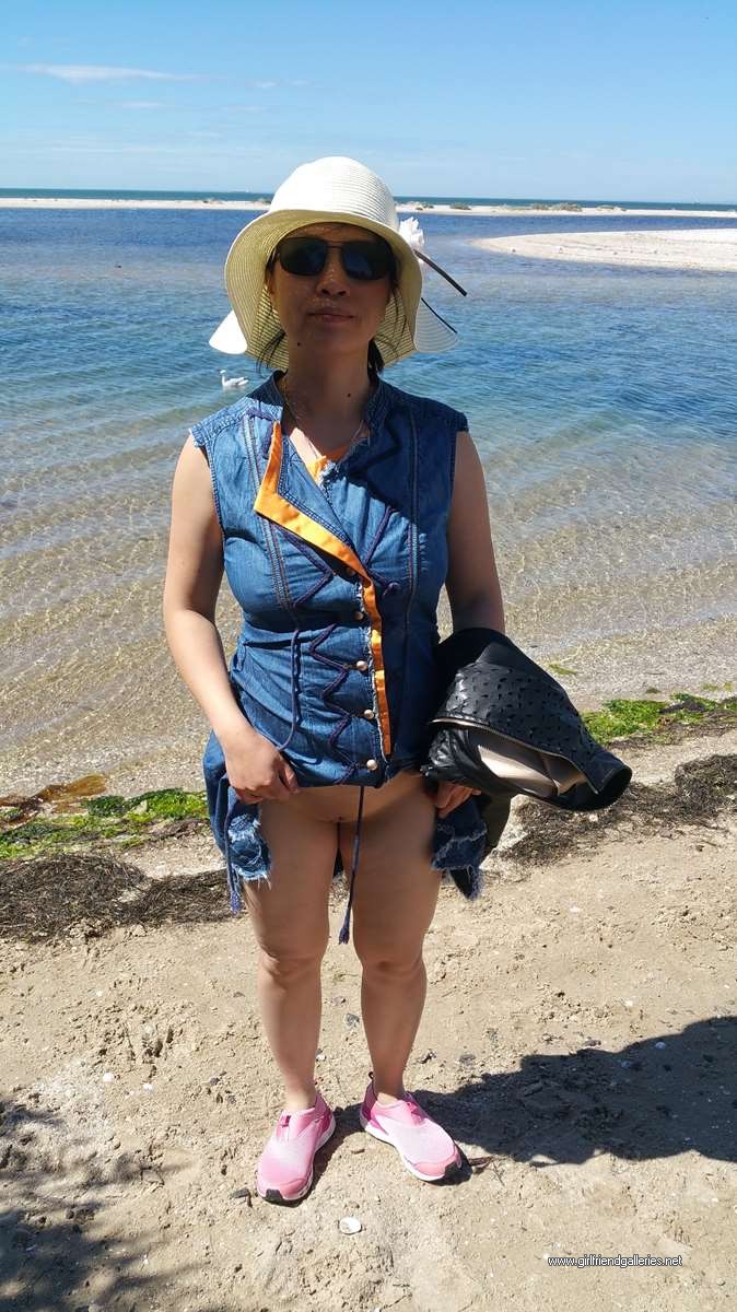 Chinese wife flashing at beach